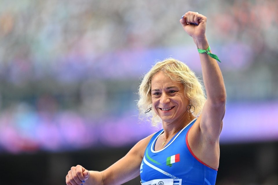 a woman in a blue tank top with an italian flag on it