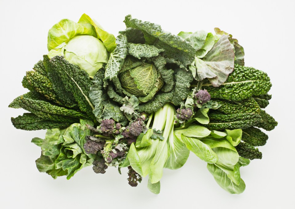 a bunch of green vegetables on a white background