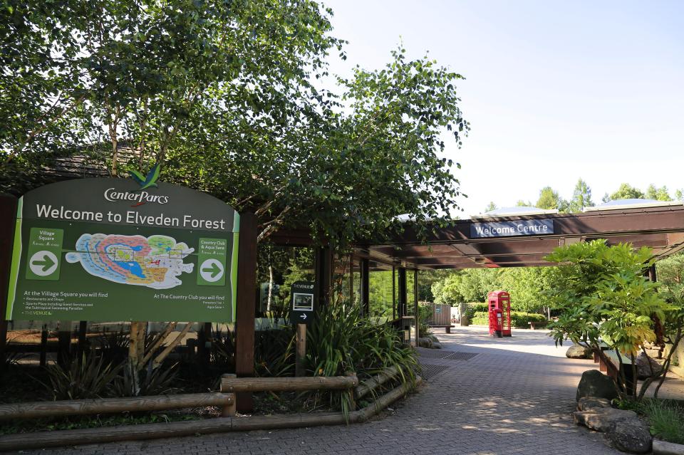 a welcome to elveden forest sign in front of a building