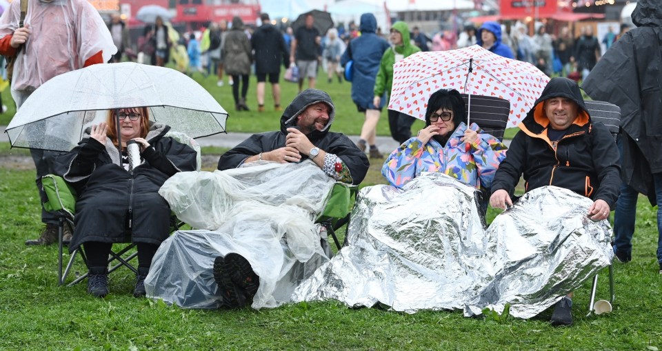 People sheltering in the Parkat Moor Park in Preston on Sunday