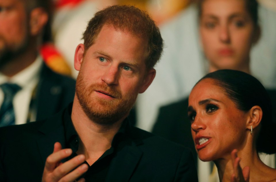 a man with a beard is talking to a woman