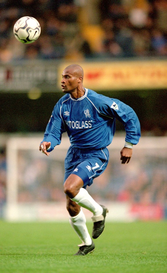 a soccer player wearing a blue shirt that says toglass on it