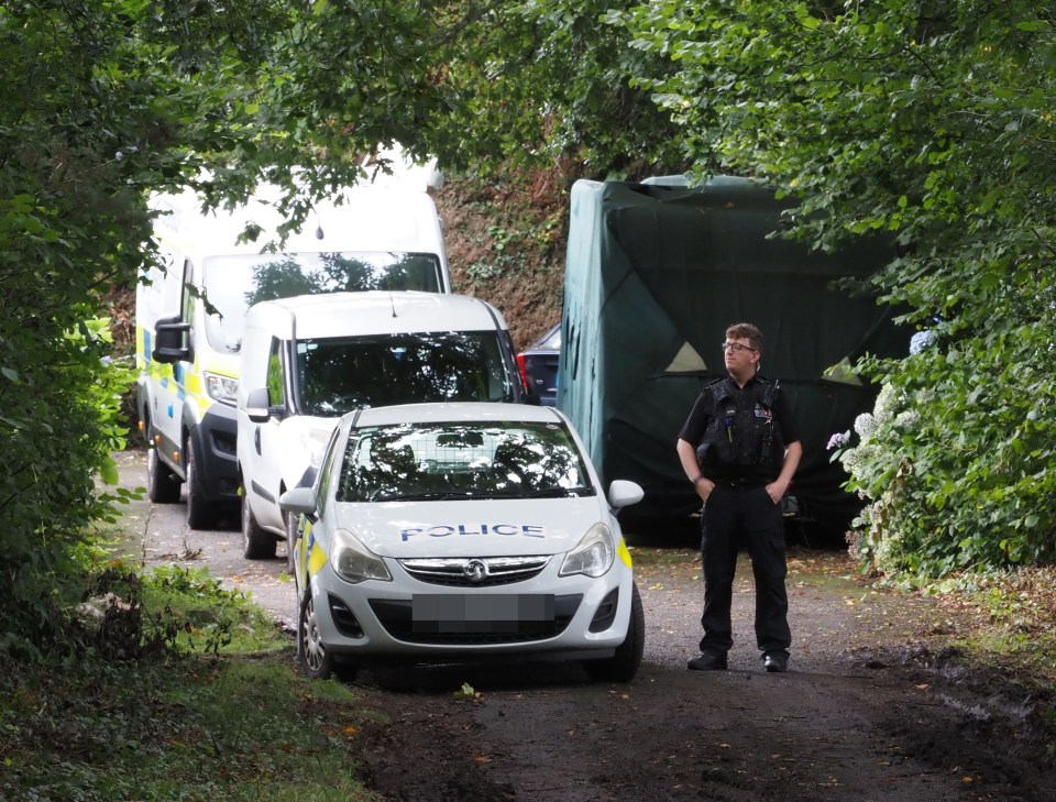 Police at the scene after a woman and child died at a property in Fletchersbridge, Bodmin, Cornwall