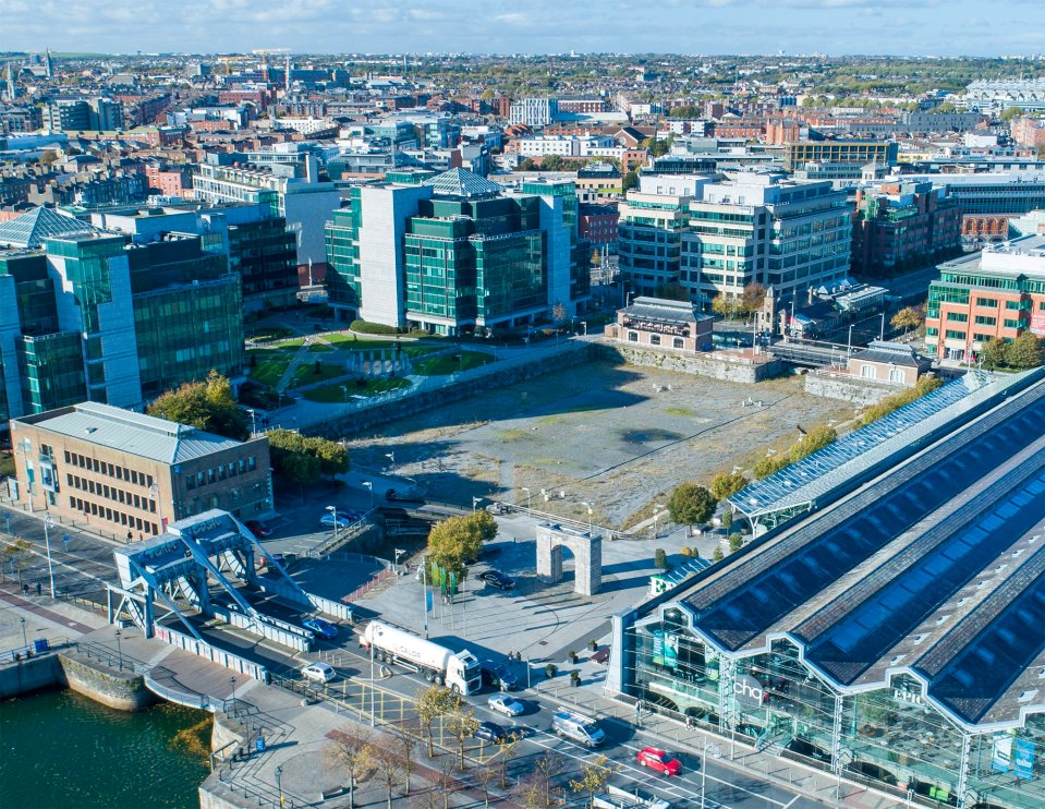 an aerial view of a city with lots of buildings and a bridge