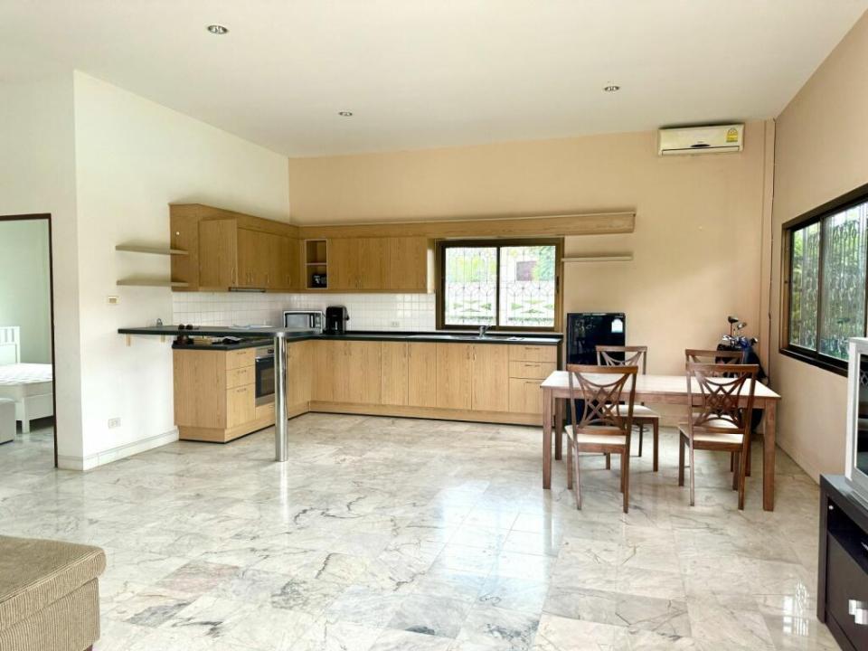 a kitchen with a table and chairs in it