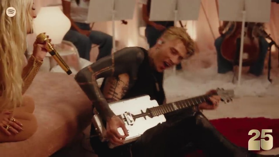 She also got Machine Gun Kelly to play guitar on Genie In A Bottle