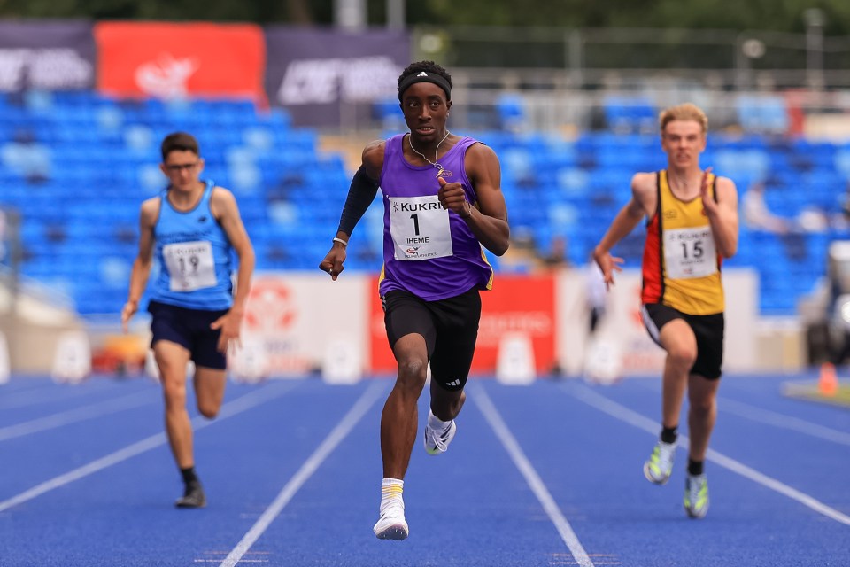 a man in a purple tank top with the number 1 on it