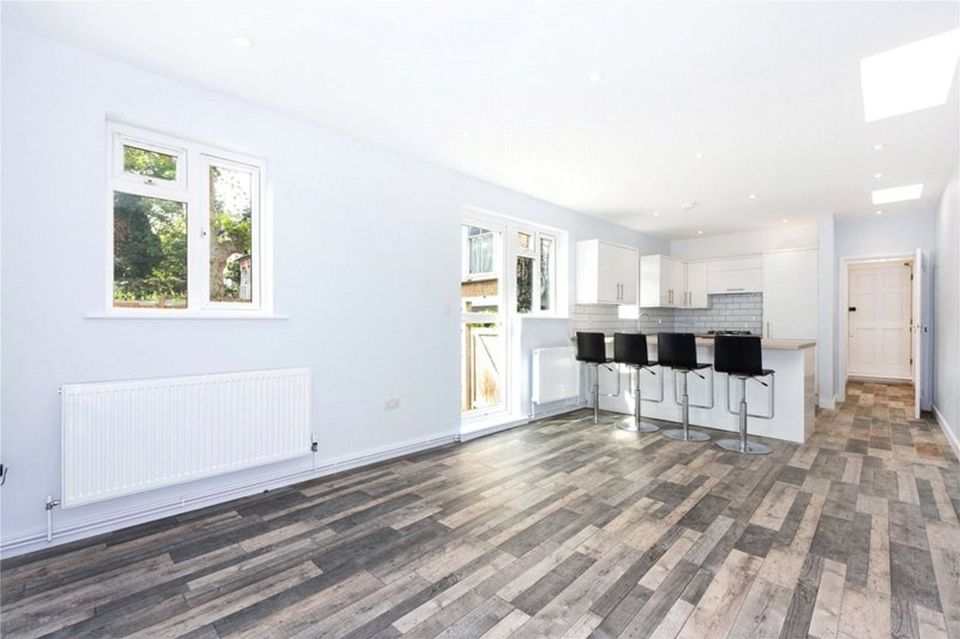 The reception room and kitchen inside the home