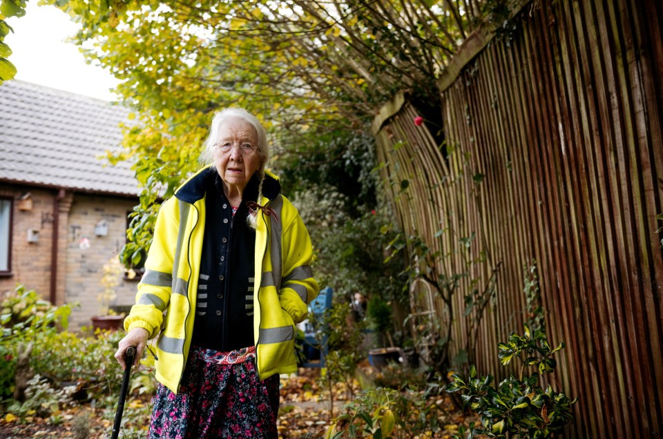 The bushes are so heavy they are causing her fence to buckle