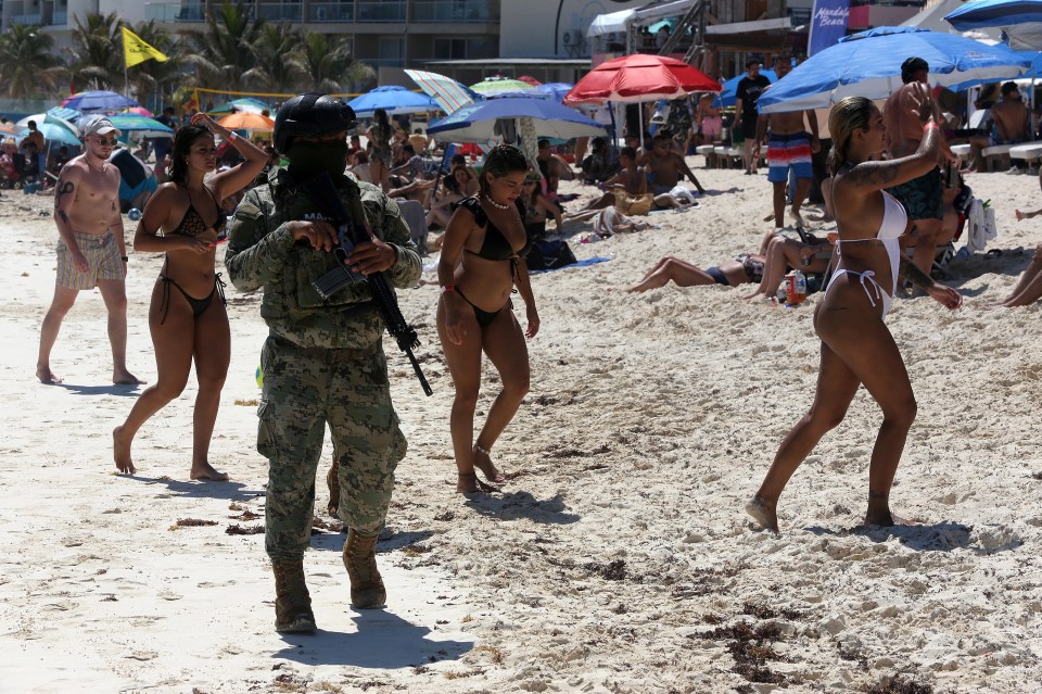 Soldiers patrol a beach in Cancun, Mexico, in 2023