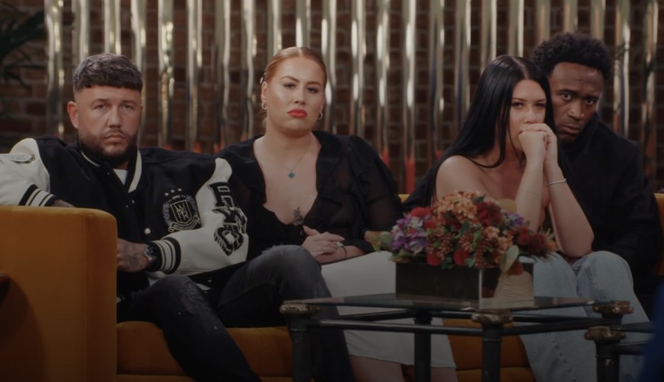 a group of people sitting on a couch with one wearing a jacket that says ufc