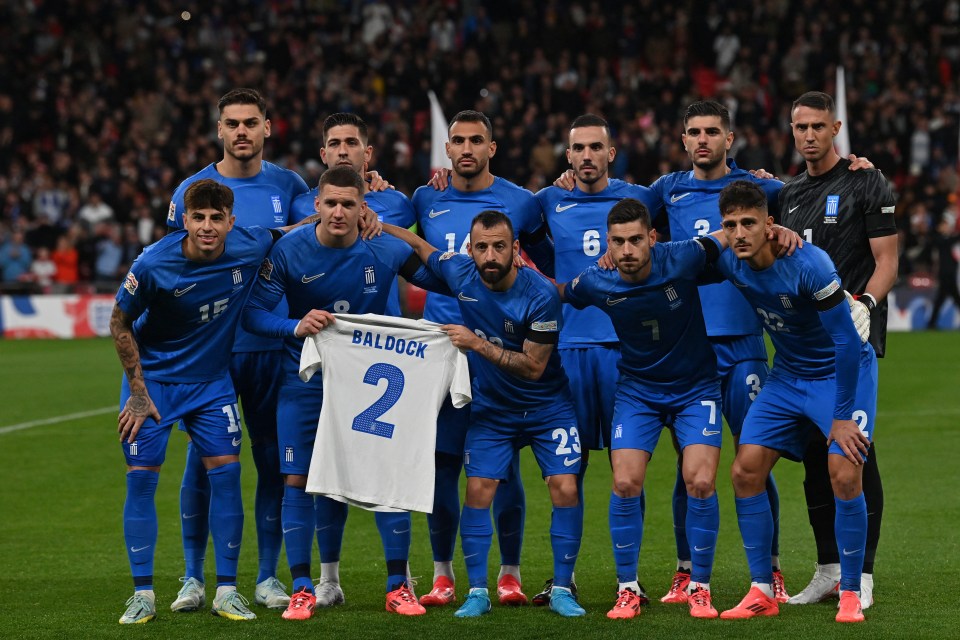 Greece stars held up a shirt of Baldock before the match