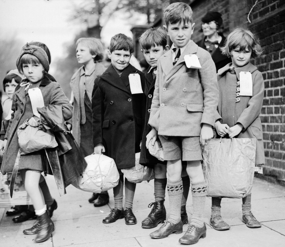 City kids with names on labels being evacuated to the countryside in 1938