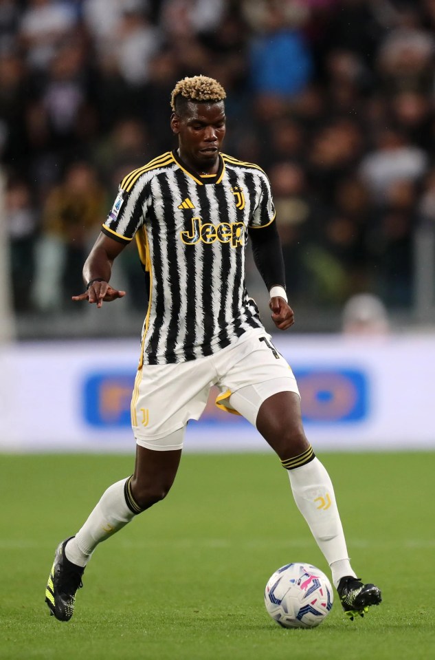 a soccer player in a black and white jeep jersey