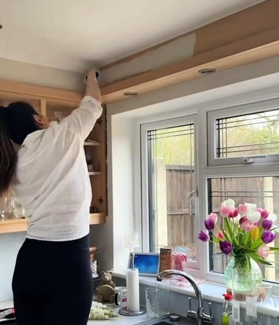 Sarah got to work painting all the cupboards in the kitchen