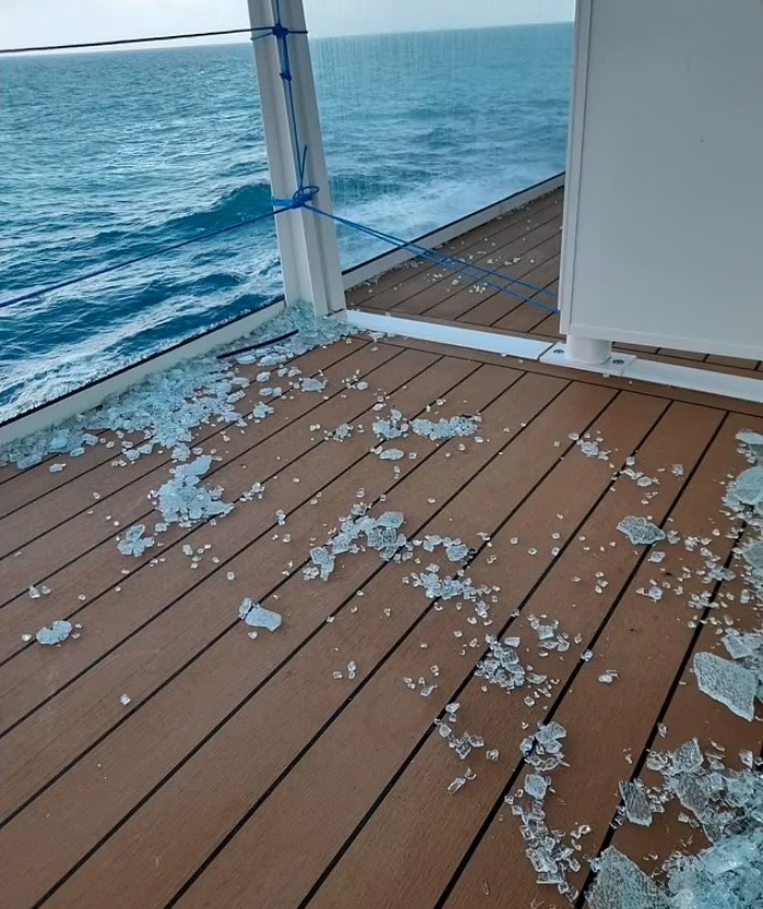 Pictures from the cruise ship show broken glass from a balcony after the storm