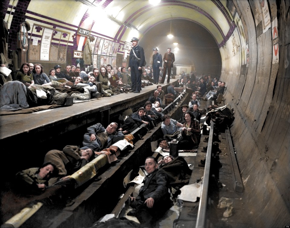 A colourised photo shows Londoners sheltering from an air raid in one of the capital's Tube stations