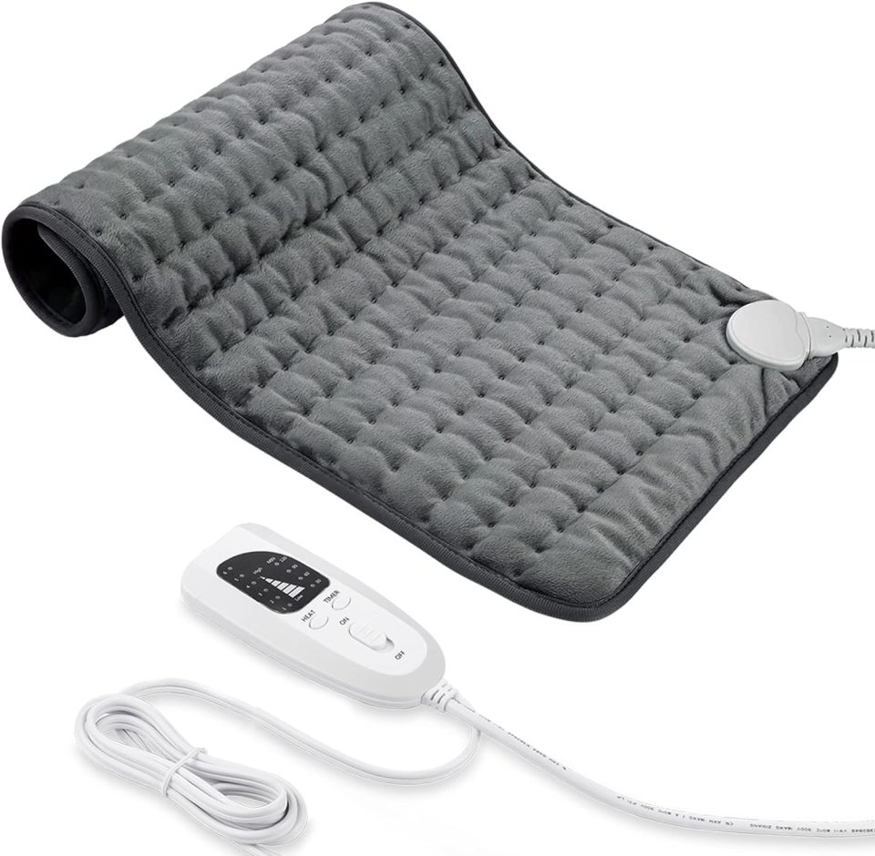 a grey electric blanket with a white remote control