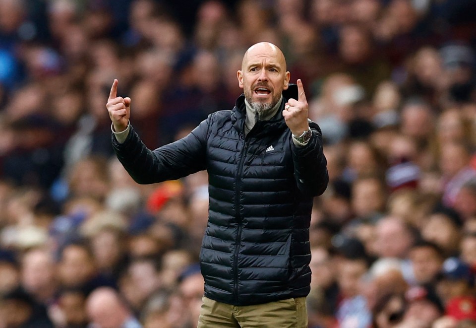 a bald man wearing a black adidas jacket stands in front of a crowd