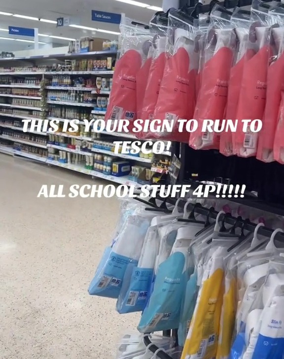 a store aisle with a sign that says this is your sign to run to tesco