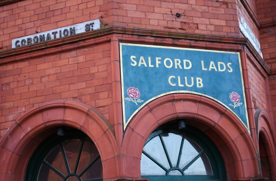 a sign that says salford lads club on it