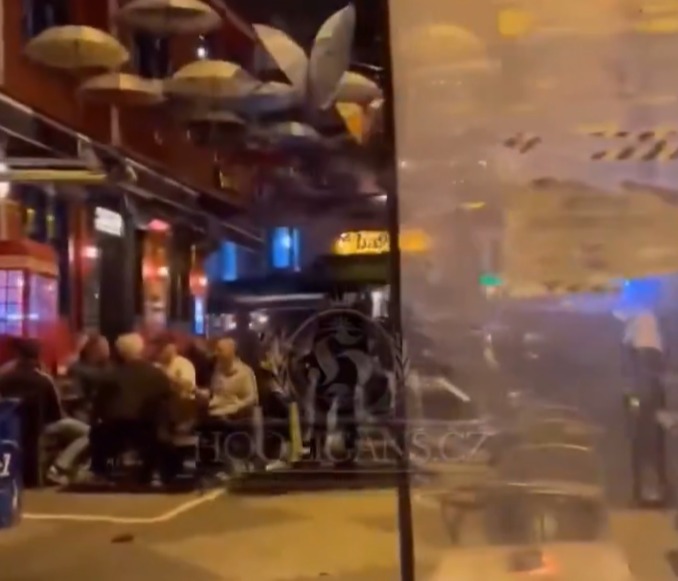 Man Utd fans were seen having a drink outside a bar