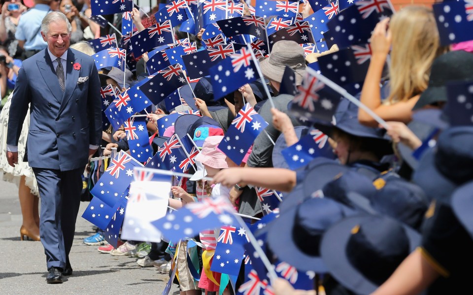 Youngsters wave Australian flags for Charles in Adelaide in 2012