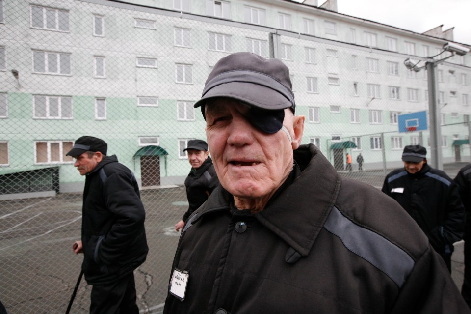 Inmates walk at a high-security male prison camp outside Russia’s Siberian city of Krasnoyarsk