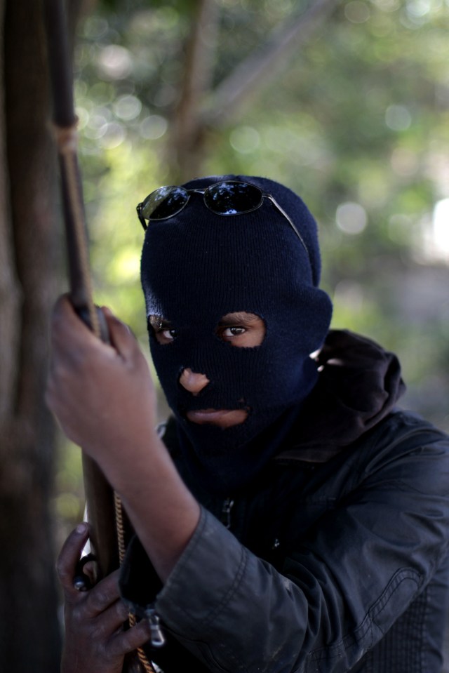 A hooded resident of Tecoanapa, in the Mexican southern state of Guerrero, in 2013