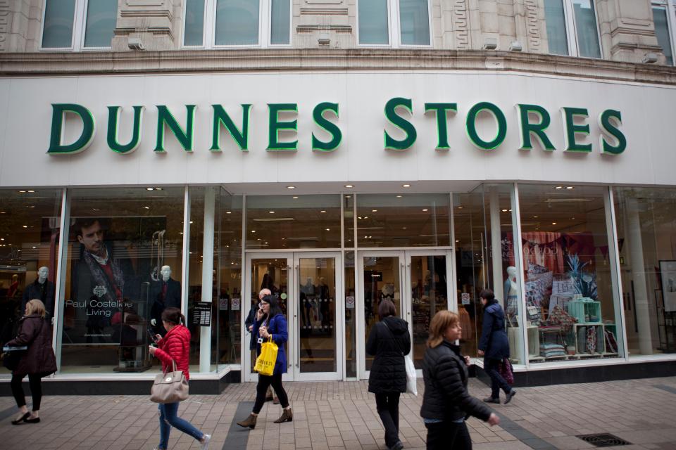 people walking in front of a dunnes store