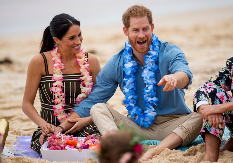 Harry and Meghan during a meeting with a local surfing community group, known as OneWave, at Bondi Beach in Sydney