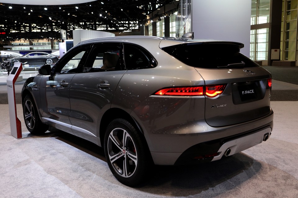 a jaguar f pace is on display at a car show