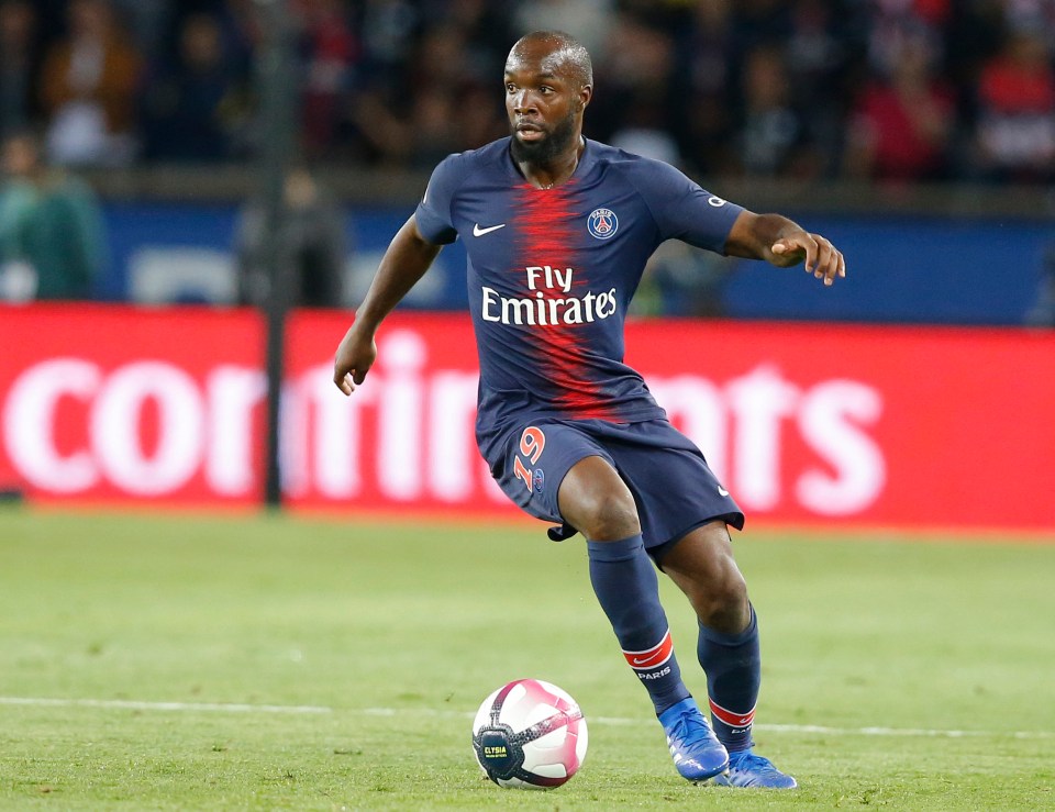 a soccer player with fly emirates on his jersey