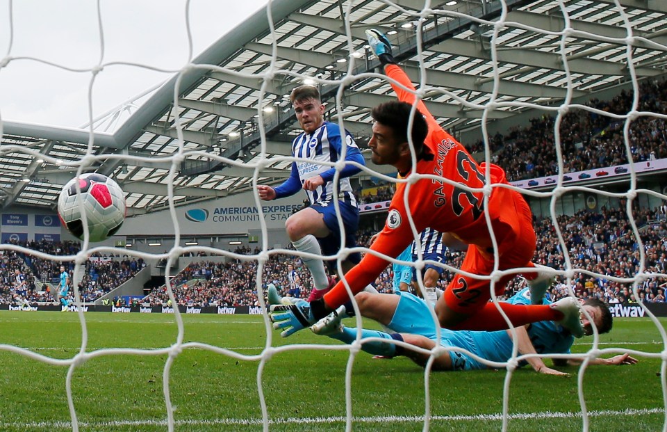 a soccer game is being played in front of an american express sign