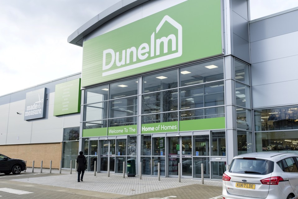 a dunelm store with a car parked in front of it