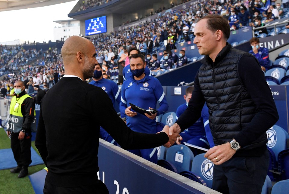 two men shake hands in front of a stadium that says final