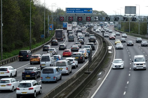 a busy highway with a sign that says the south west