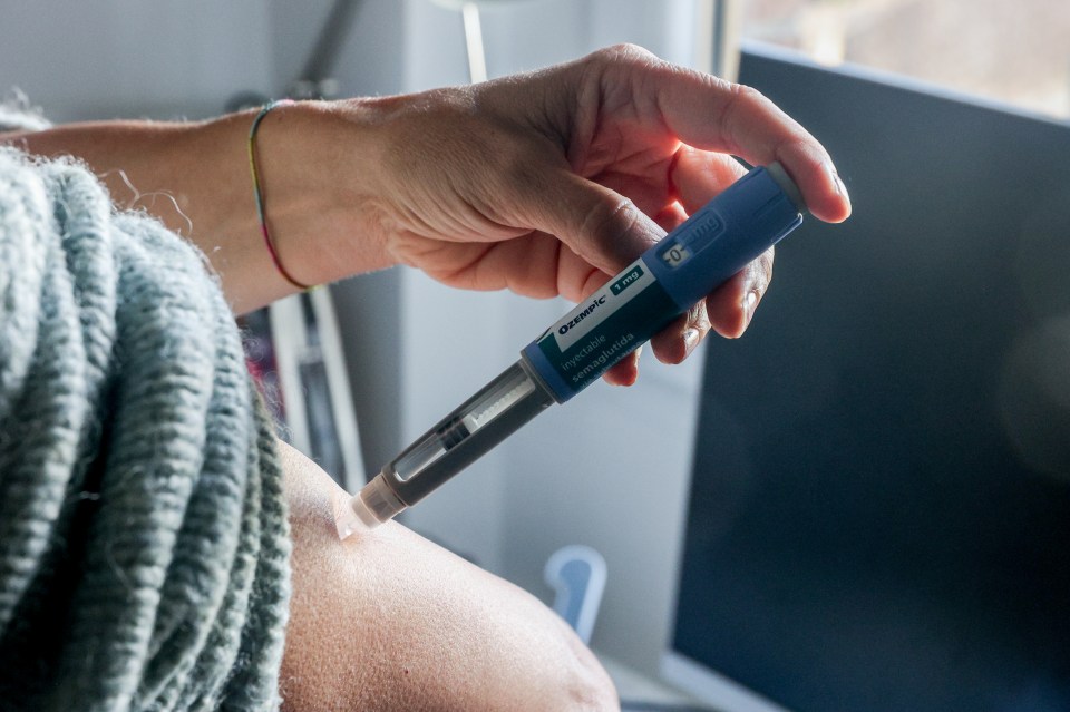 a person is using a panasonic insulin pen