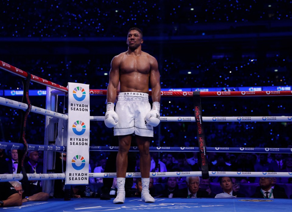 a boxer stands in front of a sign that says riyadh season