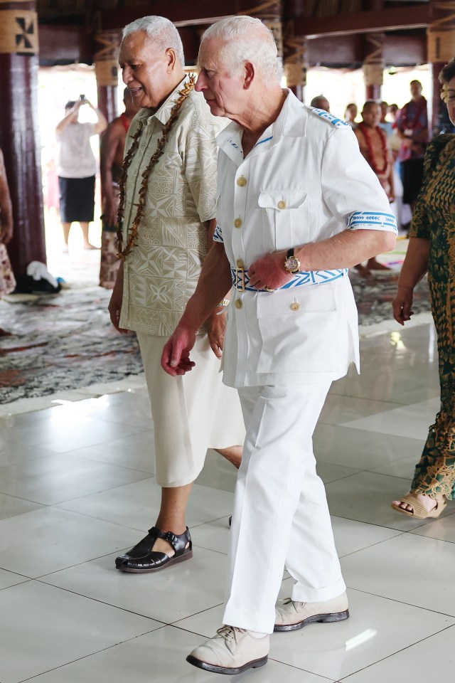 The King wore a white bush jacket with embroidery by Samoan School of Fine Art