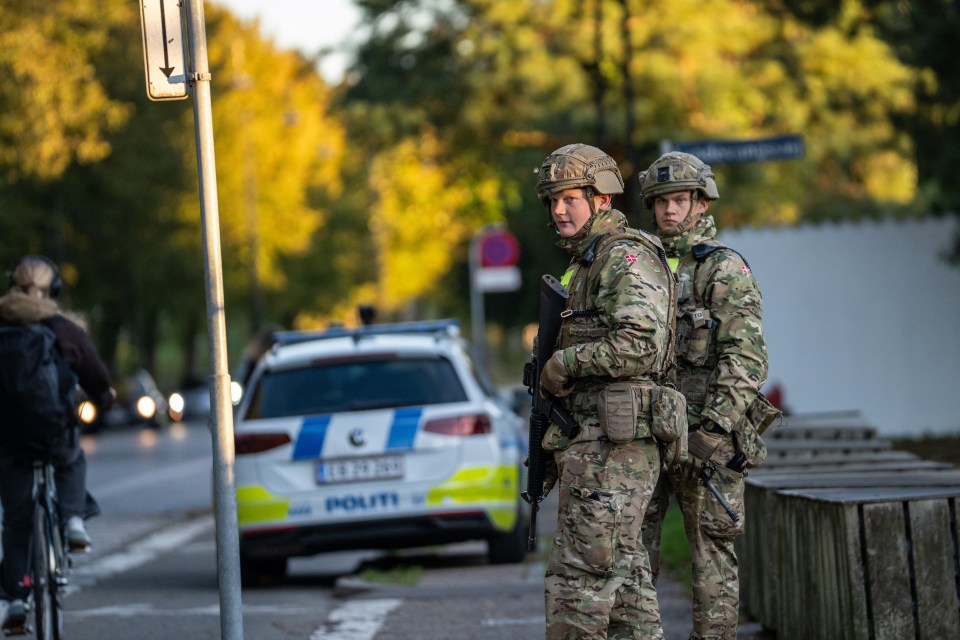 Military Police guard the perimeter of the Israeli embassy in Copenhagen following two blasts from grenades