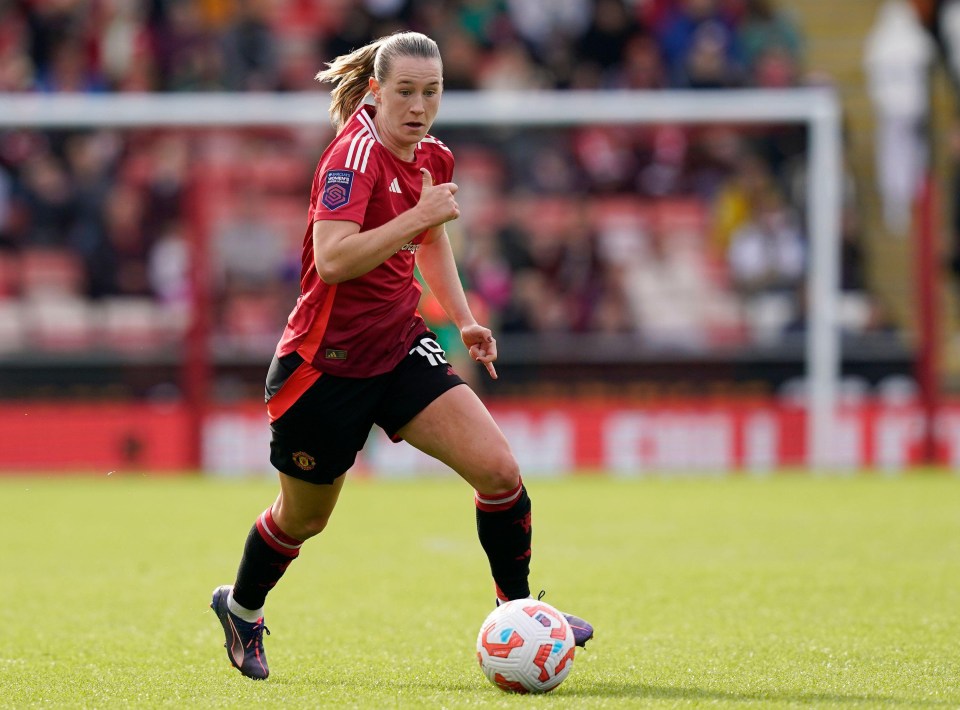 a female soccer player with the number 18 on her jersey