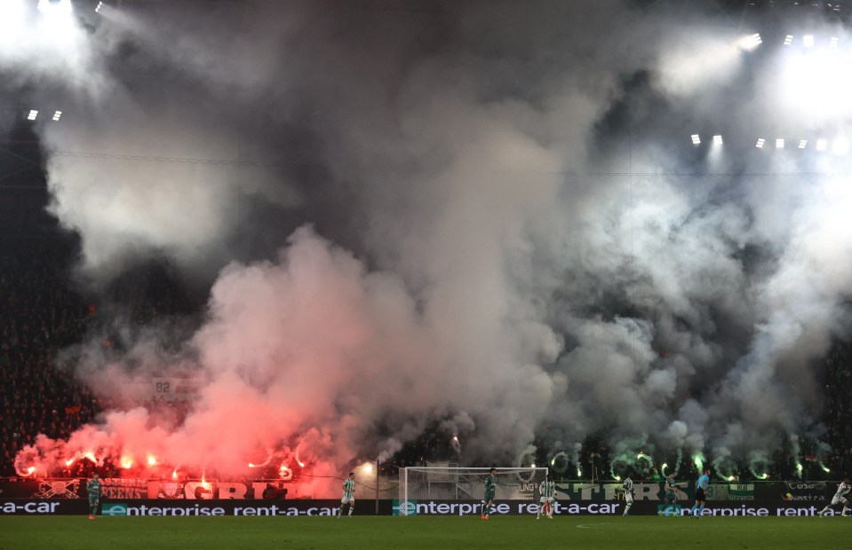 Smoke from flares quickly drifted across the pitch