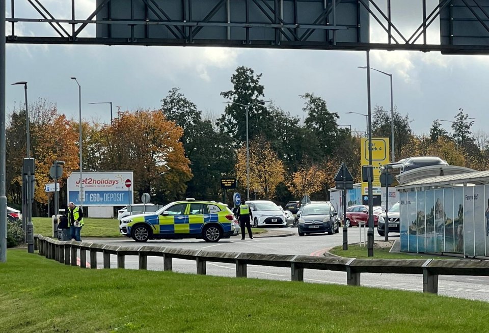 a jet2 holidays sign is behind a police car