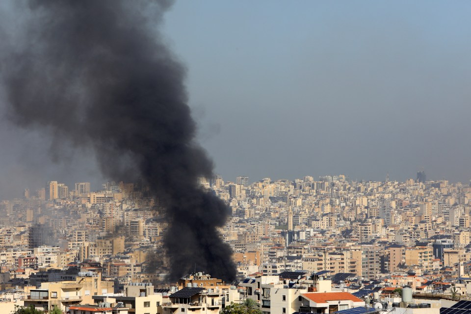 Smoke rises from buildings hit in an overnight Israeli airstrike that targeted Beirut’s southern suburbs