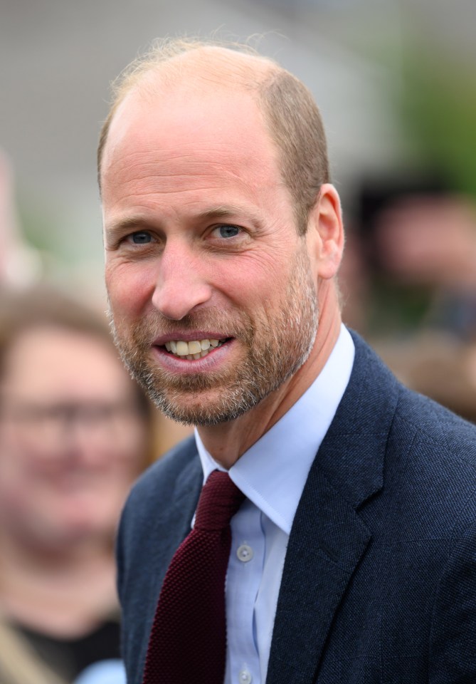 a bald man with a beard wearing a suit and tie