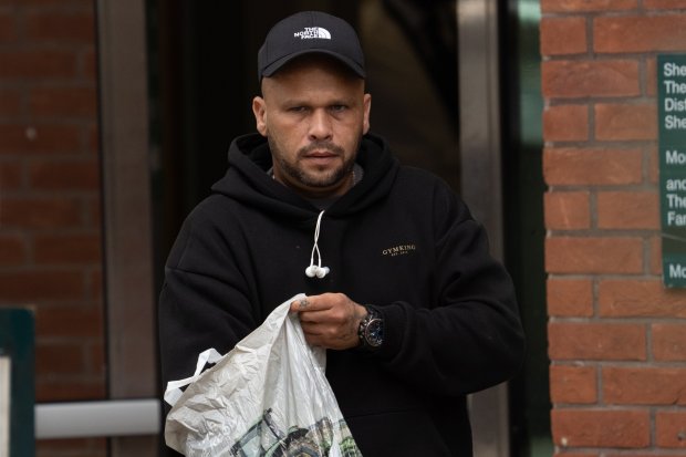 a man wearing a hat that says the north face