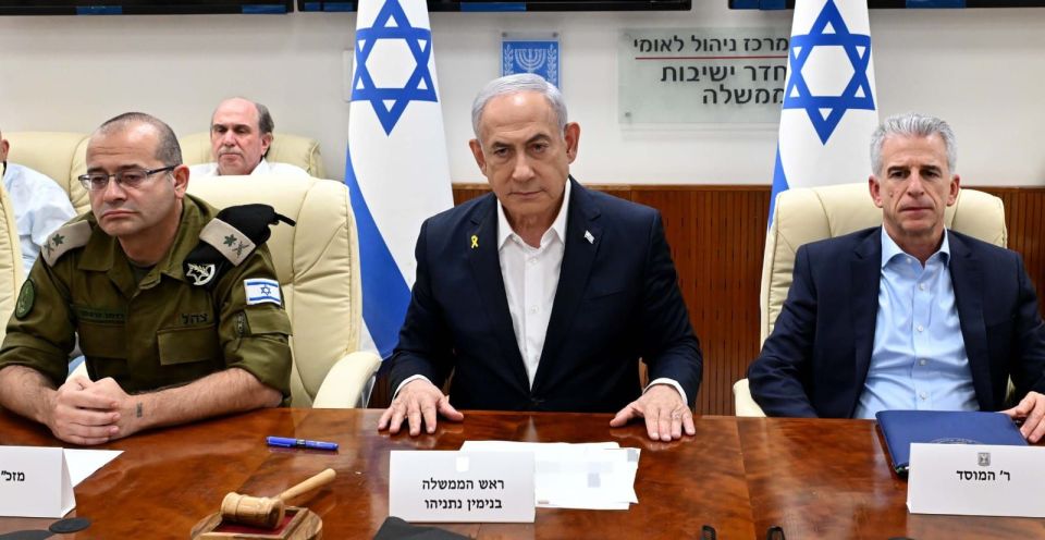 Israeli Prime Minister Benjamin Netanyahu, centre, says Iran 'will pay' for its missile strike