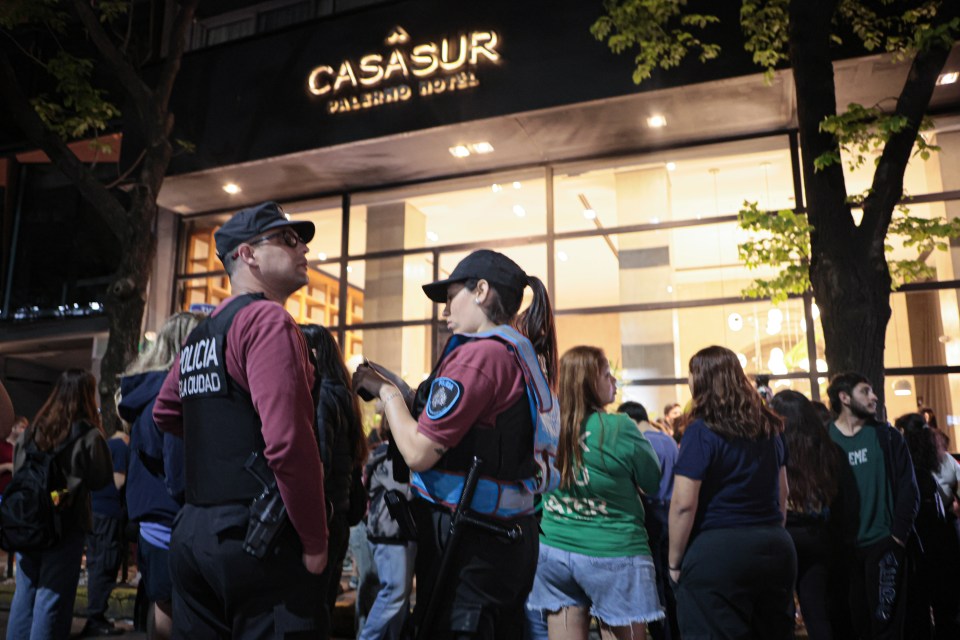 Police and fans outside the CasaSur hotel