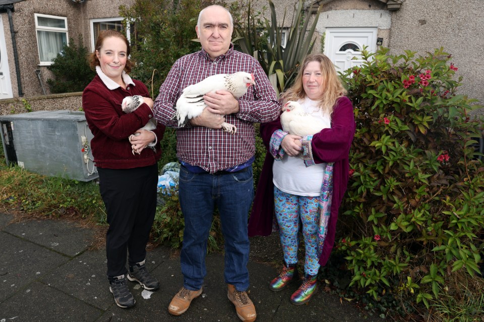 Edward pictured with his wife Marie (right) and fellow rescuer Rachel Wilson